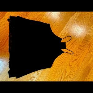 Sleeveless black top with lace